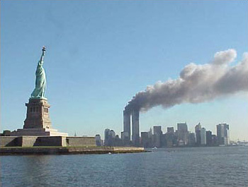 Twin towers of the World Trade Center burning.